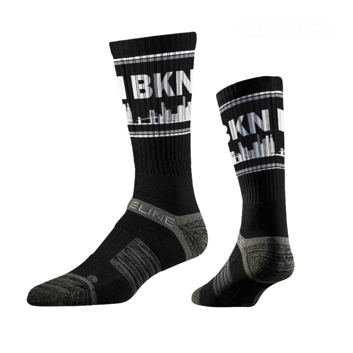 Skyline Crews Collection black socks featuring a skyline design and cushioned support. Limited edition crew style.