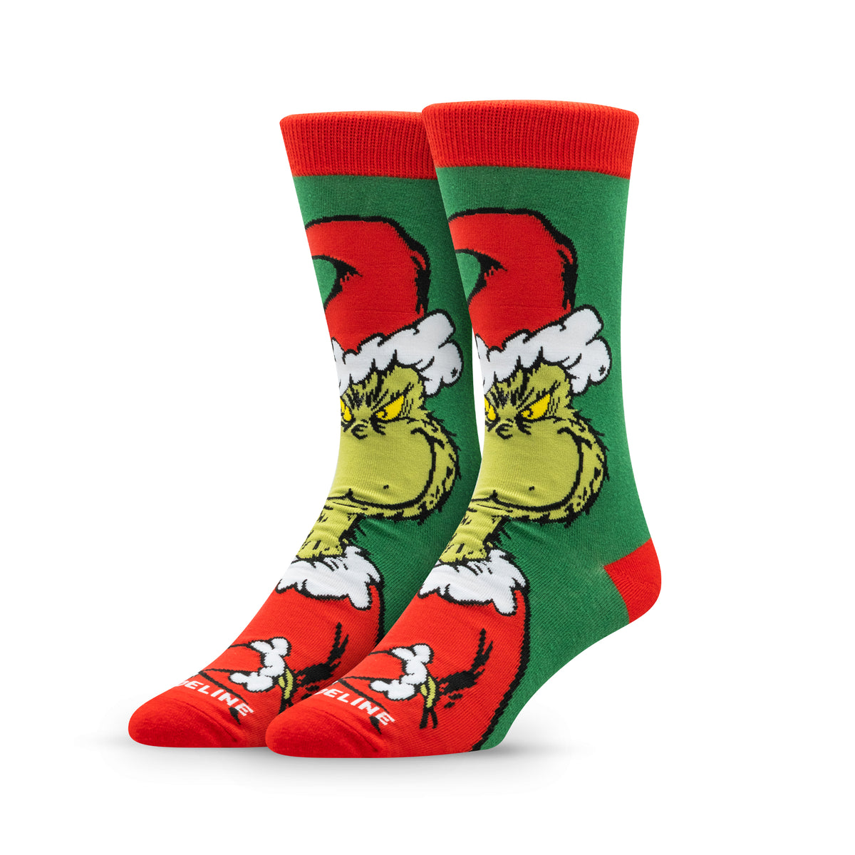 Green and red socks featuring a cartoon Grinch wearing a Santa hat.