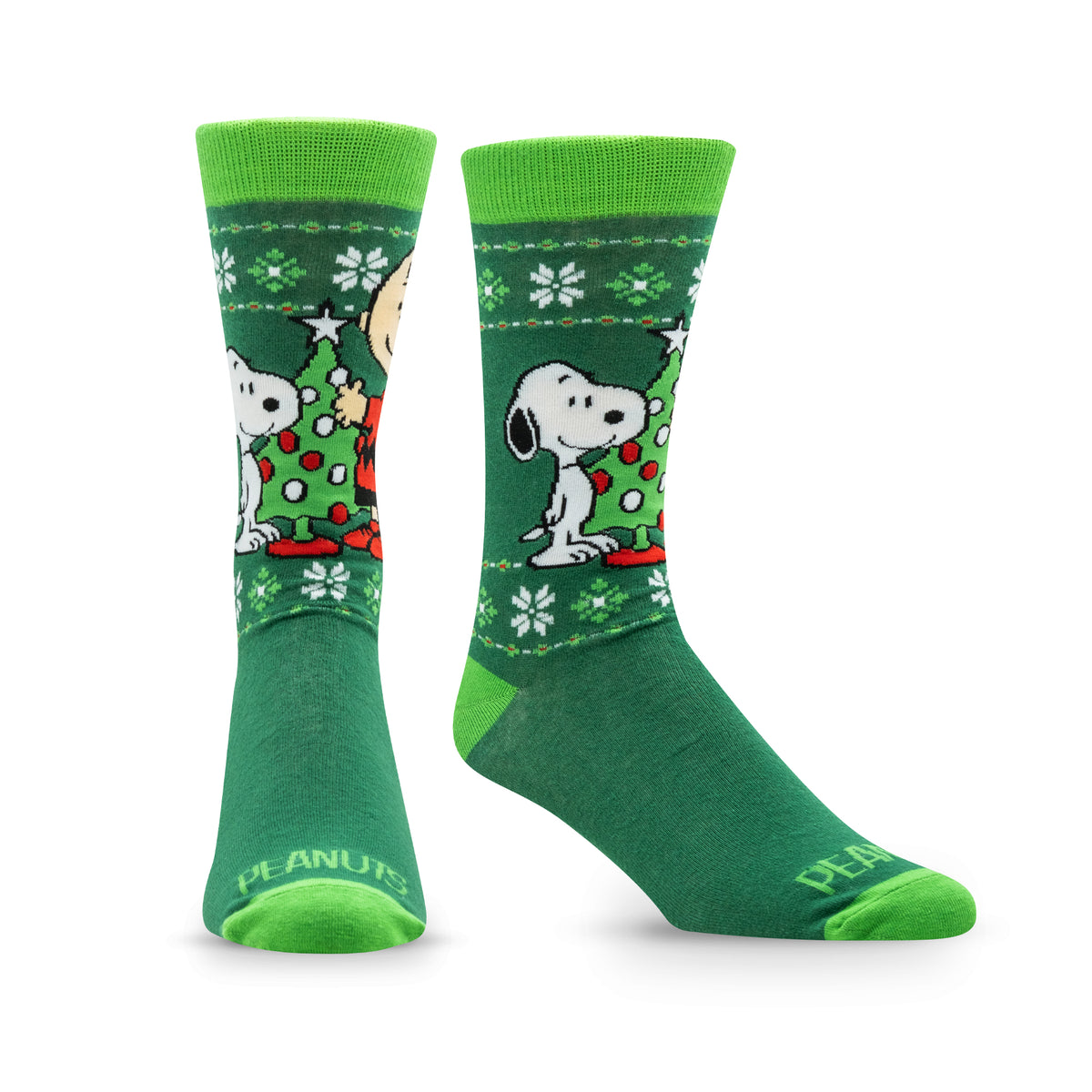 Green socks featuring Snoopy and Charlie Brown with a Christmas tree and snowflakes design.