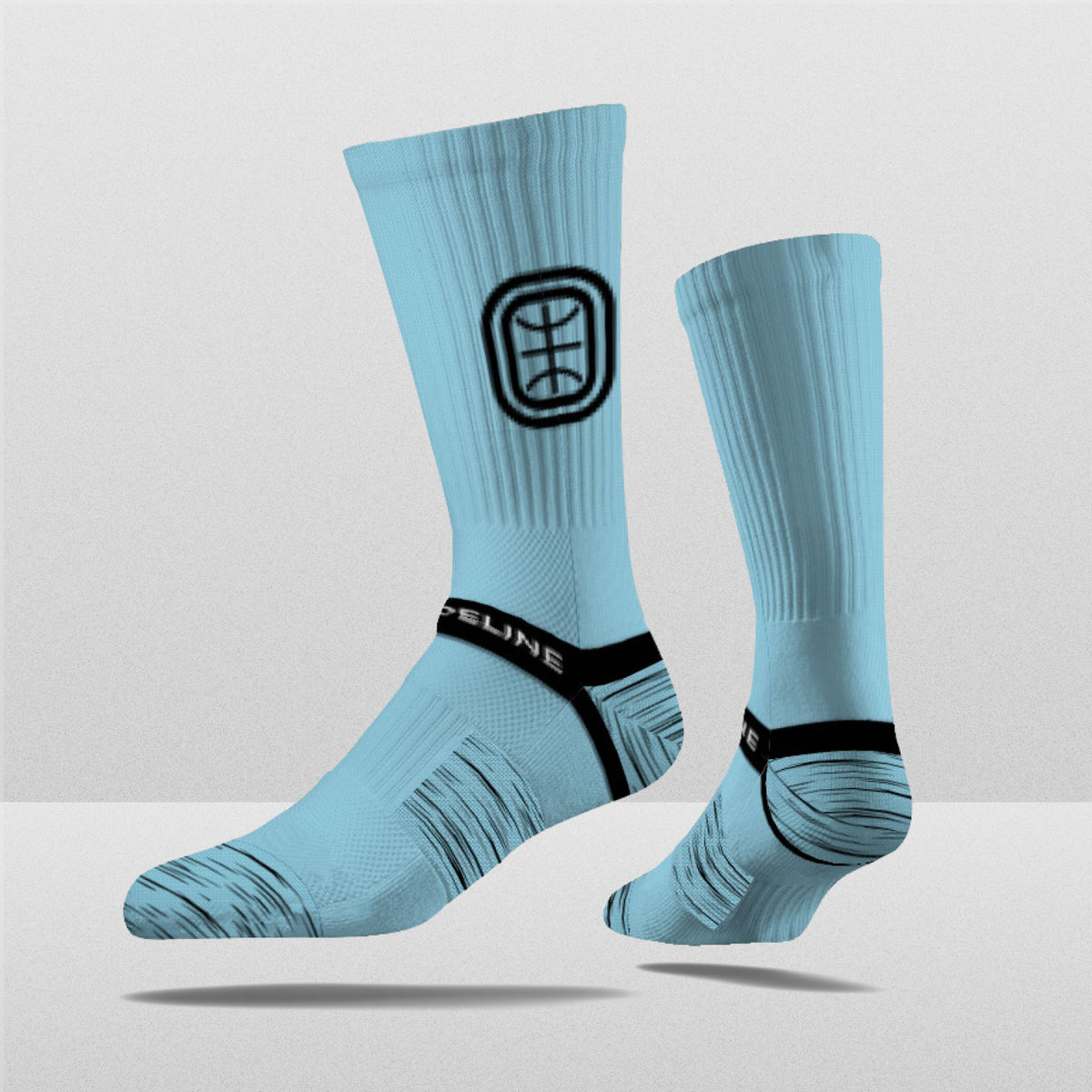 Overtime Elite Crew Socks in light blue with a black logo and textured design, perfect for fans. Limited edition.