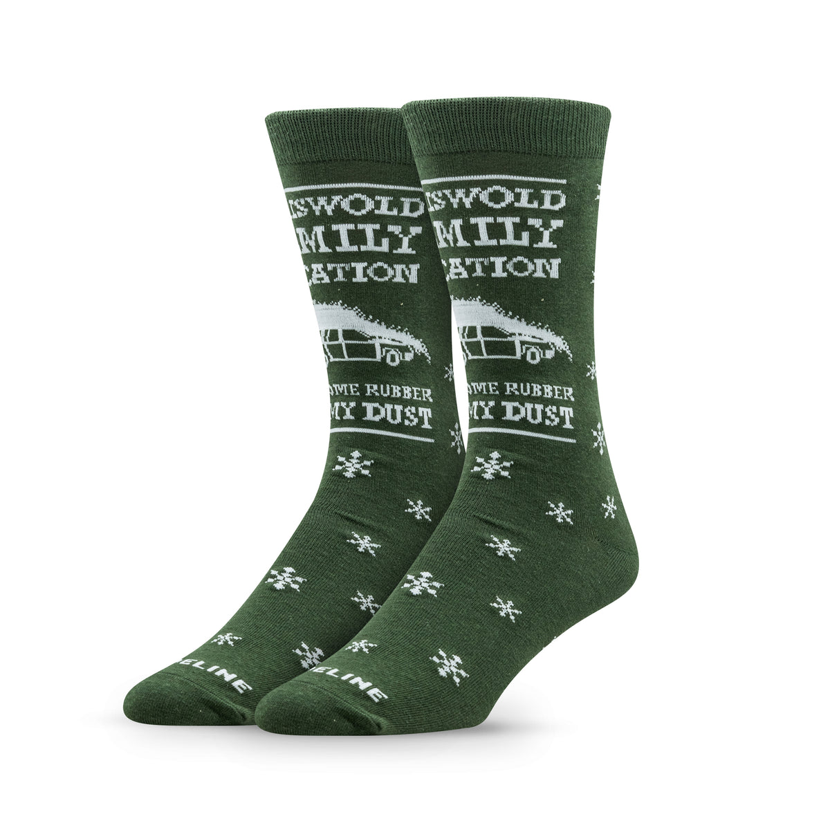 Green socks with white text and snowflake patterns, featuring a vintage truck and the phrase "Grew up on rubber, my dust.