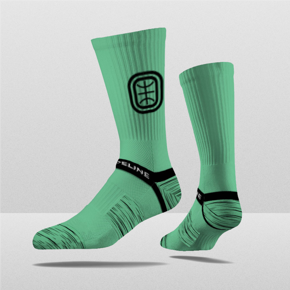 Overtime Elite Crew Socks in mint green with a logo and textured design, perfect for fans and collectors.