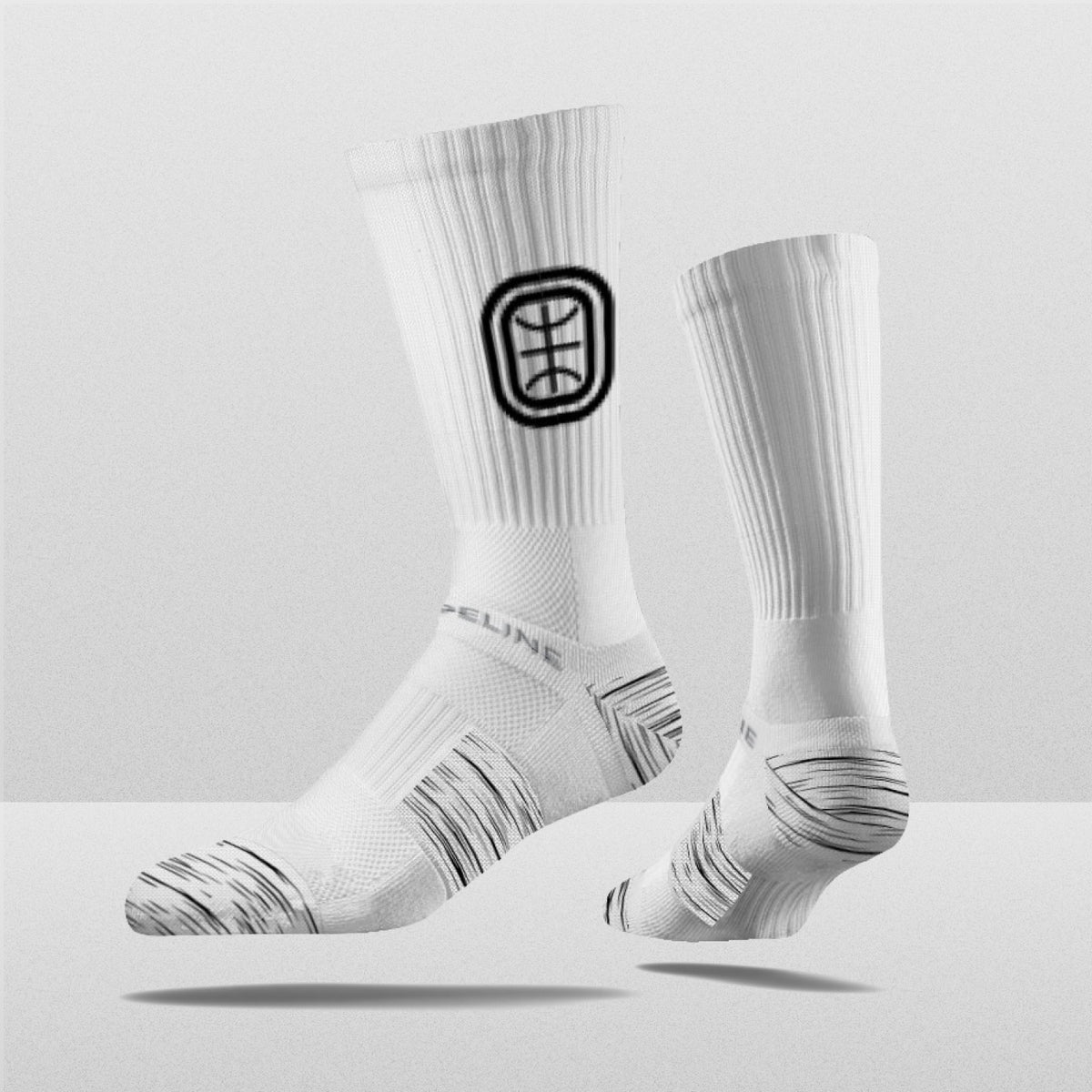 Overtime Elite Crew Socks in white with black logo, featuring a textured design for enhanced comfort.